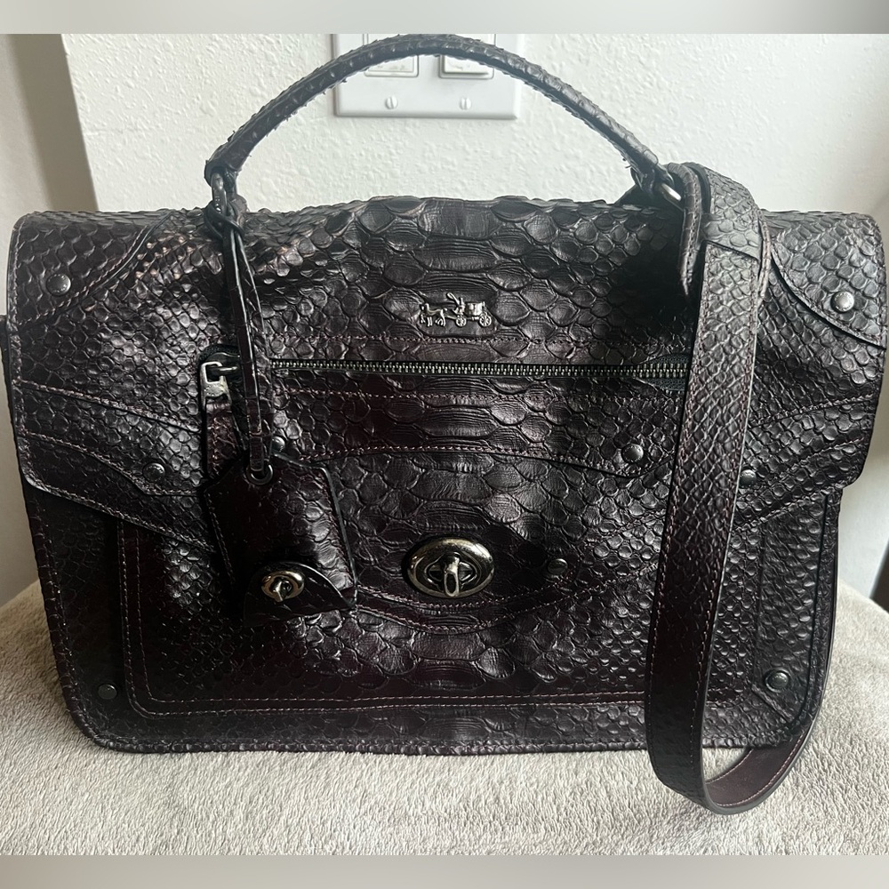 Coach Rhyder Messenger Xbody in embossed Python leather in the color Oxblood